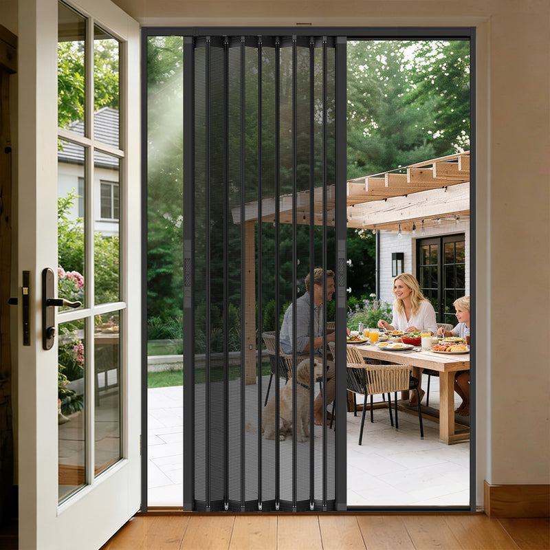 Double opening foldable security screen door installed on patio entrance with outdoor dining area